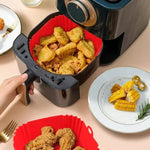 Air fryer basket with fried food 