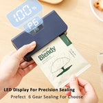 Hand using a sealing machine on a Blendy package with LED display 