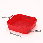 Red silicone air fryer basket liner placed inside an air fryer basket