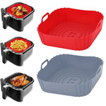 Silicone air fryer basket liner being lifted out after cooking