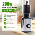 Whole fruit being fed into cold press juicer chute